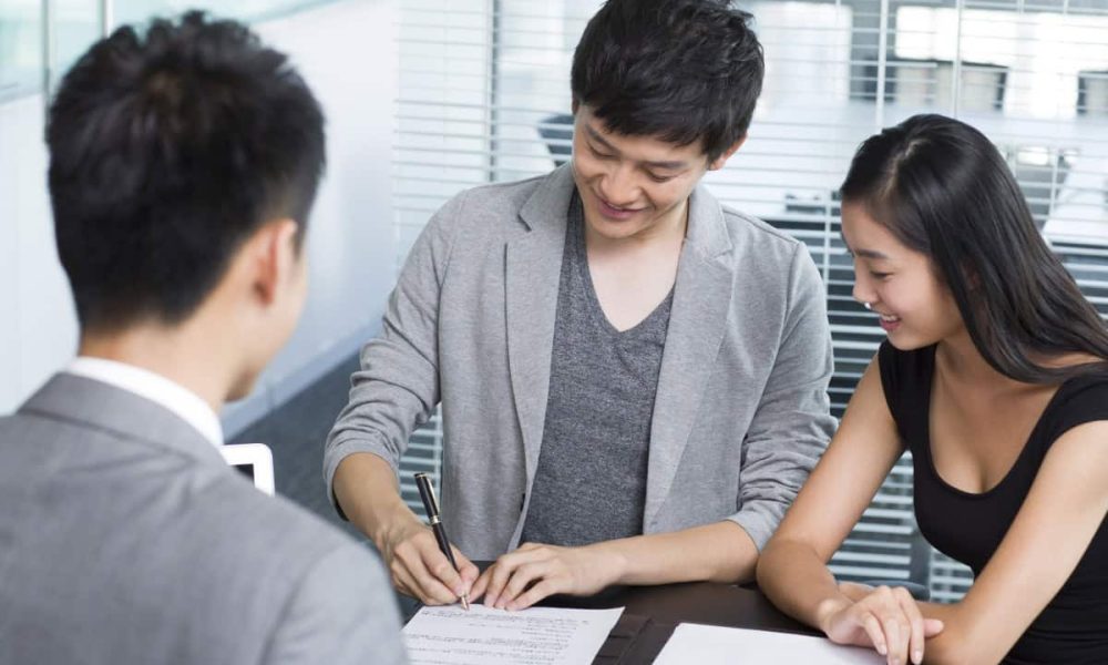 young-couple-with-financial-consultant-2022-03-24-15-21-03-utc